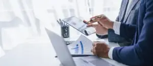 someone filling out an online LegitScript certification for their weight loss clinics since they need to have it