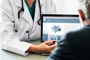 doctor shows patient how to use healthcare website